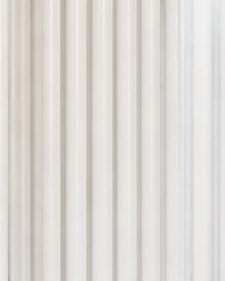 Close-up of illuminated vertical narrowband UVB lamp tubes
